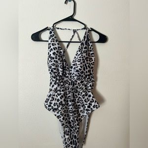 Cheetah print one piece swimsuit. Size XL. Never warn.